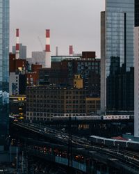 High angle view of train against buildings in city