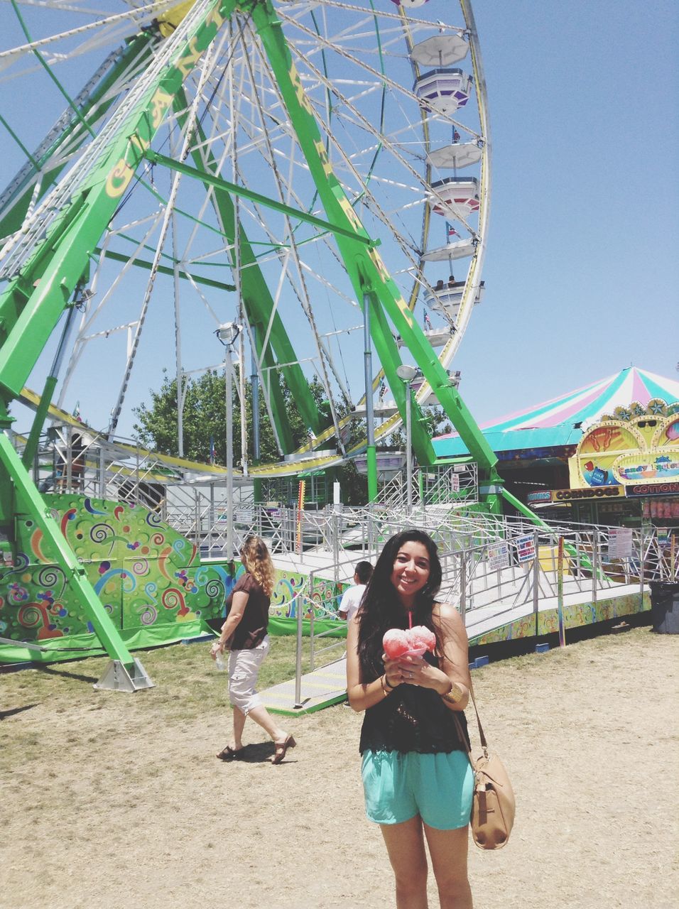 lifestyles, leisure activity, casual clothing, person, full length, childhood, clear sky, standing, boys, amusement park, fun, built structure, young adult, sunlight, elementary age, enjoyment, girls, architecture