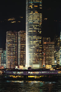 Illuminated buildings in city at night