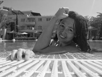 Portrait of happy woman in swimming pool