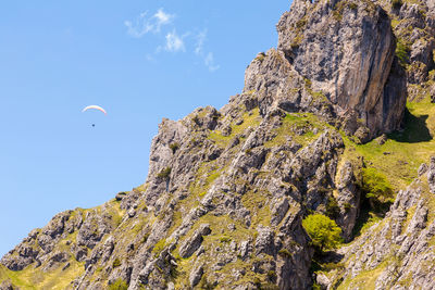 Low angle view of rock formation against sky