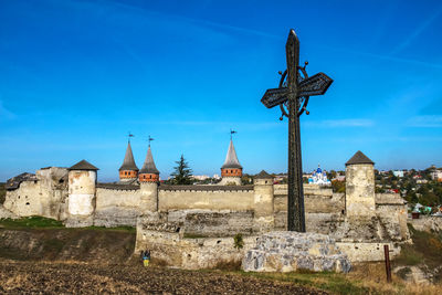 Low angle view of cemetery against sky