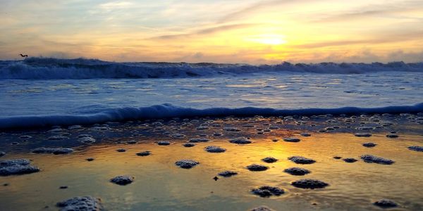 Scenic view of sea against sky during sunset