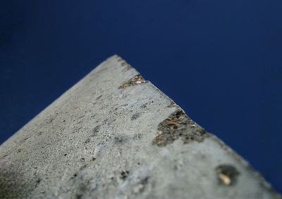 Close-up of retaining wall against clear blue sky
