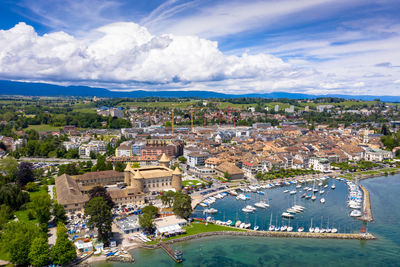 High angle view of townscape against cloudy sky