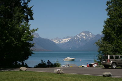 Scenic view of lake and mountains against clear sky