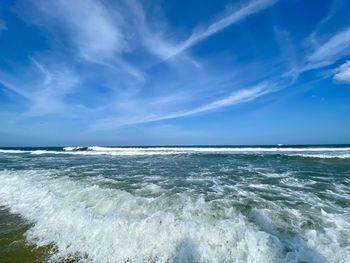 Scenic view of sea against blue sky
