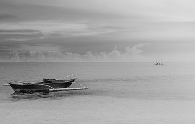 Boat in sea against sky