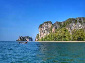 Scenic view of sea against clear blue sky