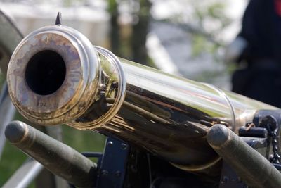 Close-up of metallic cannon outdoors