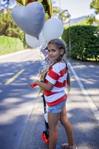 Rear view of woman holding umbrella
