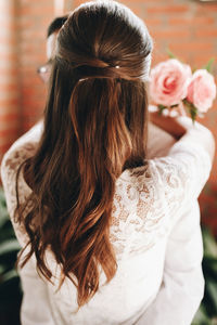 Rear view of woman embracing man during wedding