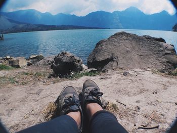 Scenic view of lake with mountains in background