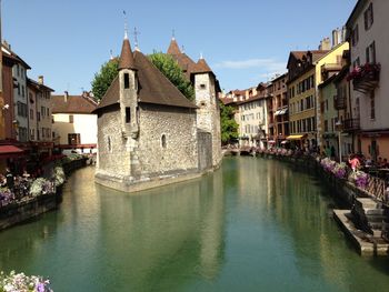 Canal amidst buildings in city