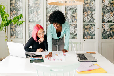 Woman using laptop on table