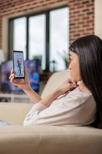 Young woman using mobile phone