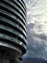 Low angle view of building against cloudy sky