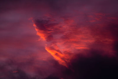 Low angle view of dramatic sky at sunset