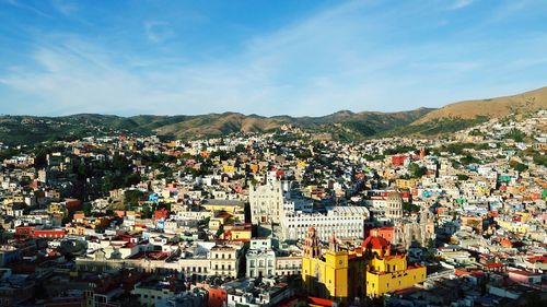 Aerial view of cityscape against sky