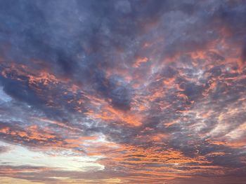 Low angle view of cloudy sky during sunset