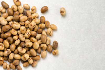 High angle view of coffee beans on white background