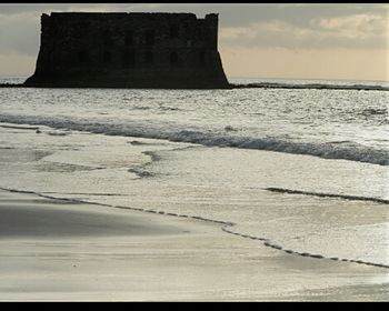 View of beach at sunset