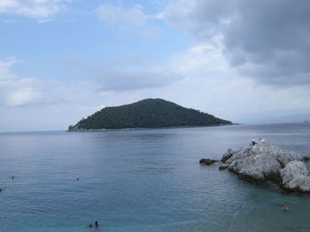 Scenic view of sea against cloudy sky