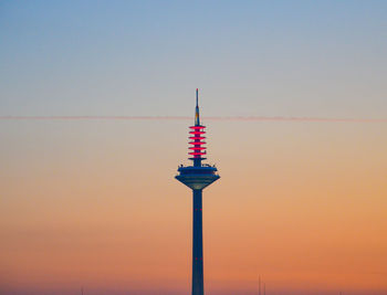 Communications tower against morning sky