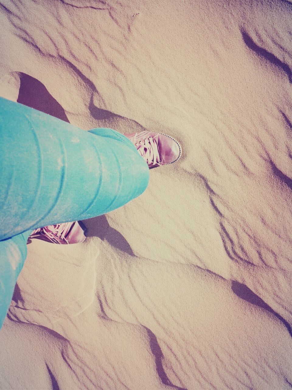 sand, beach, low section, footprint, high angle view, person, sunlight, lifestyles, sand dune, leisure activity, shadow, pattern, day, vacations, shore, outdoors, textured, sandy