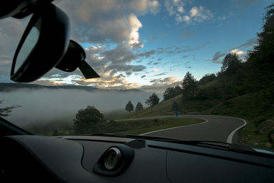 Cropped image of car on road