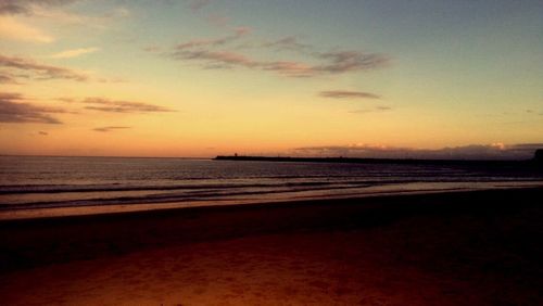 Scenic view of sea at sunset