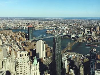 High angle view of river amidst buildings in city against sky