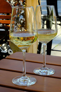 Close-up of wine glasses on table