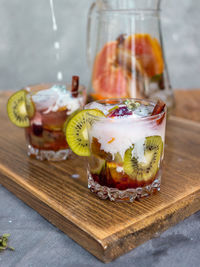 Fruits in glass jar on table