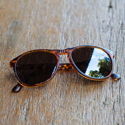 Close-up of sunglasses on table
