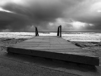 Pier over sea against sky