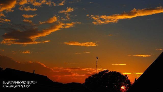 sunset, silhouette, sky, orange color, building exterior, architecture, built structure, cloud - sky, low angle view, beauty in nature, tree, scenics, cloud, dramatic sky, house, nature, high section, cloudy, outdoors, dusk