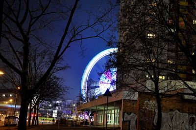 Low angle view of illuminated building at night