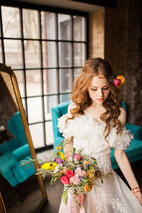 Woman holding flower bouquet