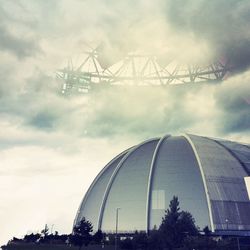 Low angle view of building against cloudy sky