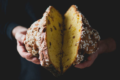 Close-up of chef's hands holding easter dove cake