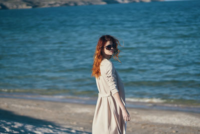 Woman standing at beach