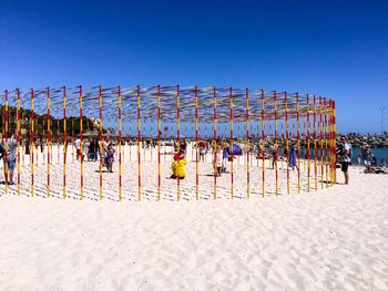 View of multi colored beach against blue sky