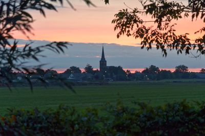 Scenic view of landscape against sky during sunset