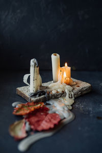 Close-up of food on table against black background