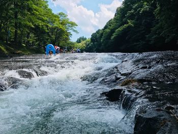 Scenic view of river flowing through rocks