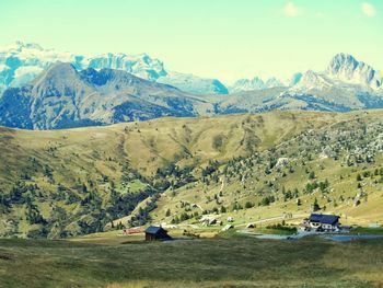 Scenic view of mountains against cloudy sky