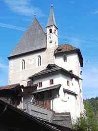 Low angle view of bell tower against sky