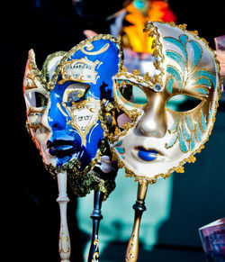 Close-up of carnival masks for sale at store