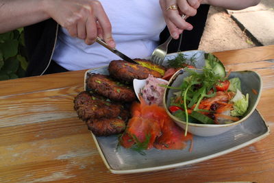 Cropped hand of person preparing food